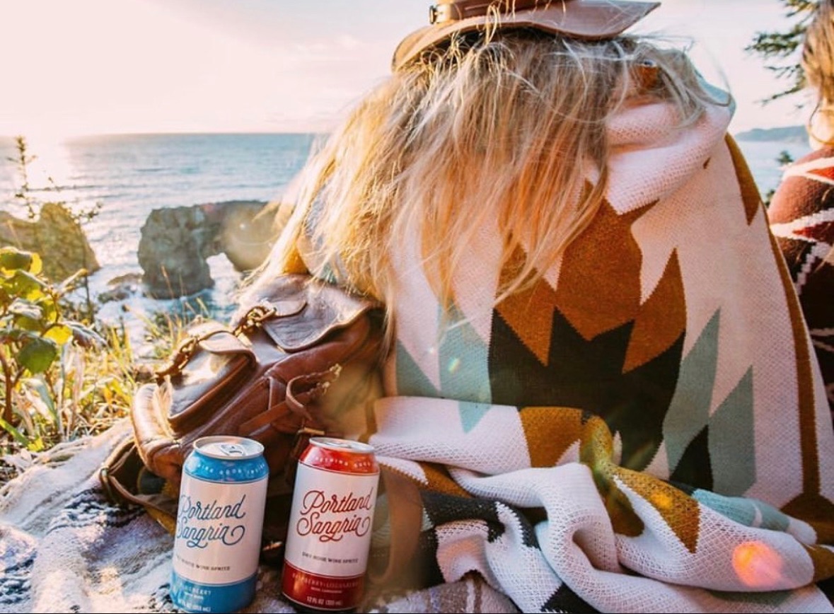Portland Sangria cans on the Oregon coast
